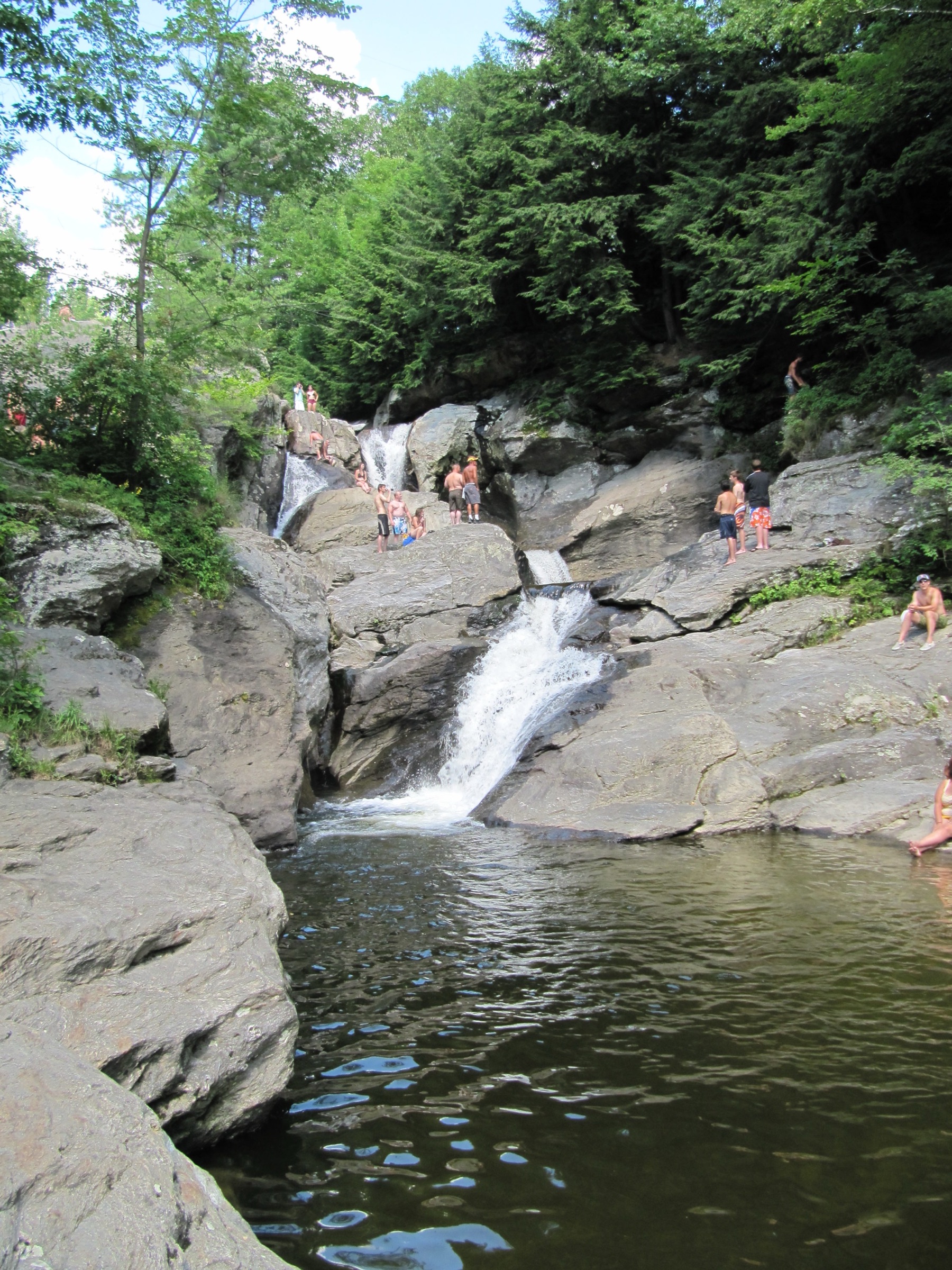 The stream drops through smooth rock ledges at Bolton Potholes in Vermont.