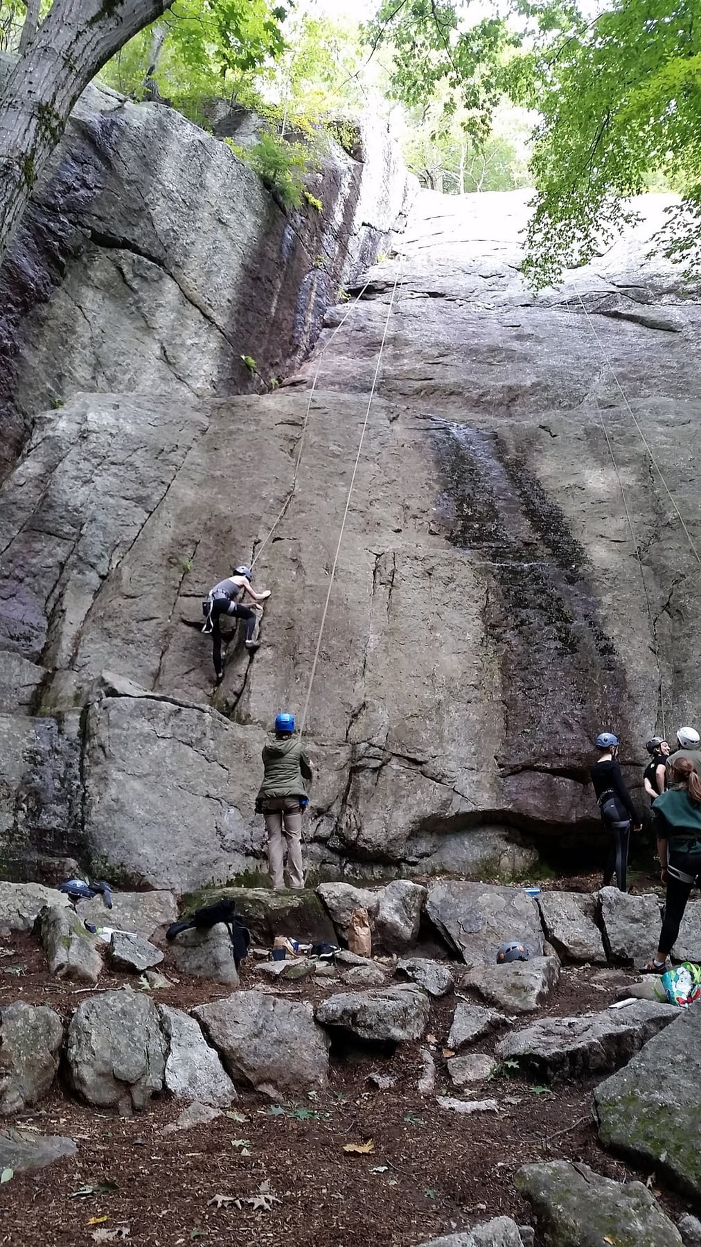 Rock climbers on a tall Chapel Brook ledge near Chapel Falls in Ashfield, Massachusetts.