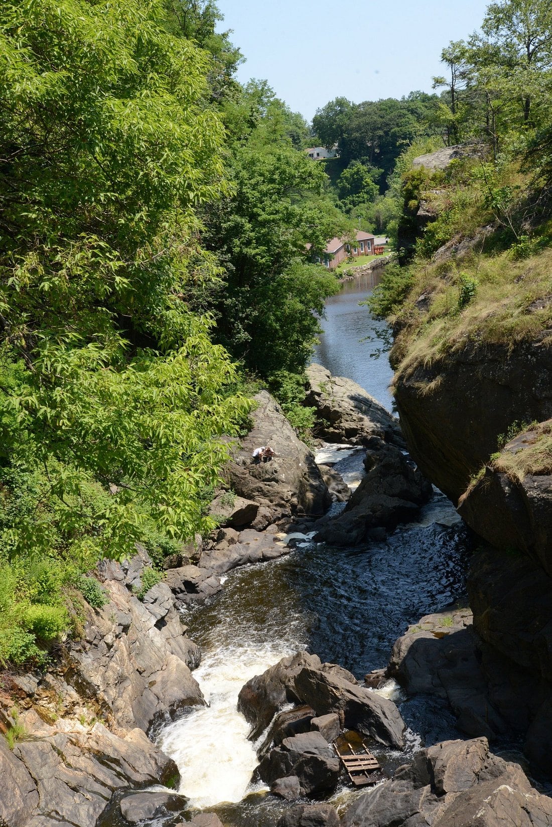The Yantic River continues through the gorge below the falls.