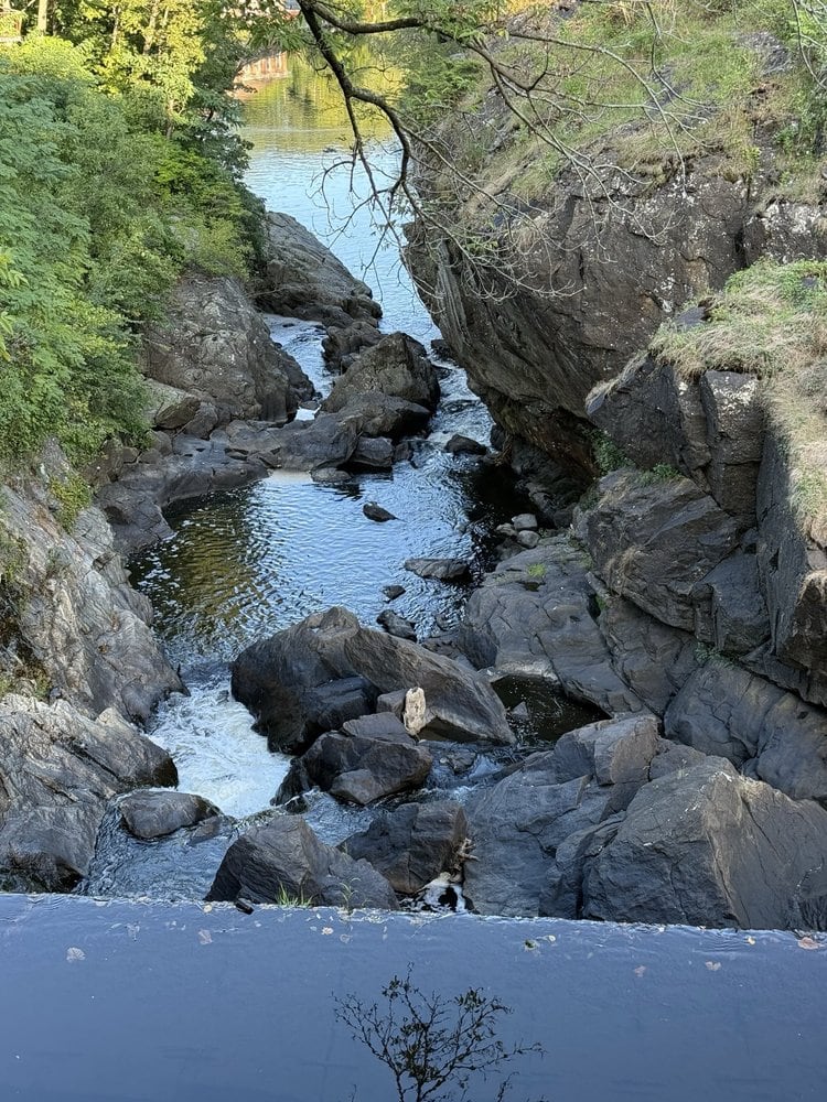 Dark rock walls frame the Yantic River gorge below Yantic Falls.
