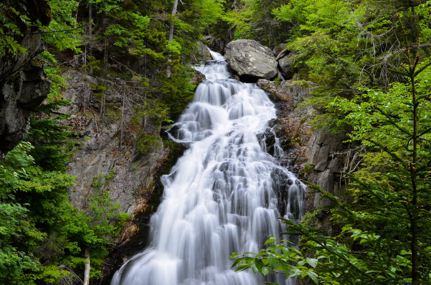 Autumn Waterfall at Crystal Cascade in New Hampshire.