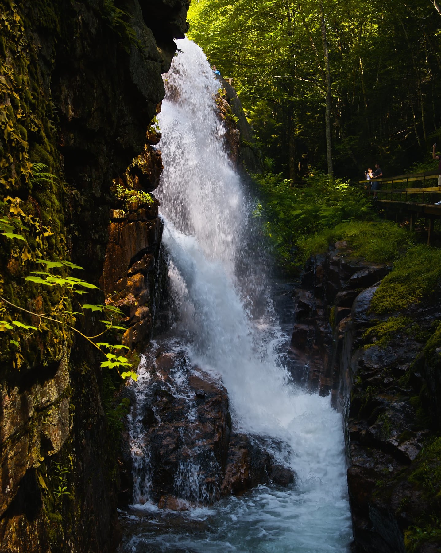 Close view of water dropping over ledges in Flume Gorge.