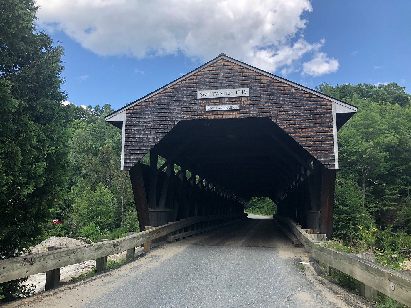 The entrance to the Swiftwater covered bridge stands above the river access.
