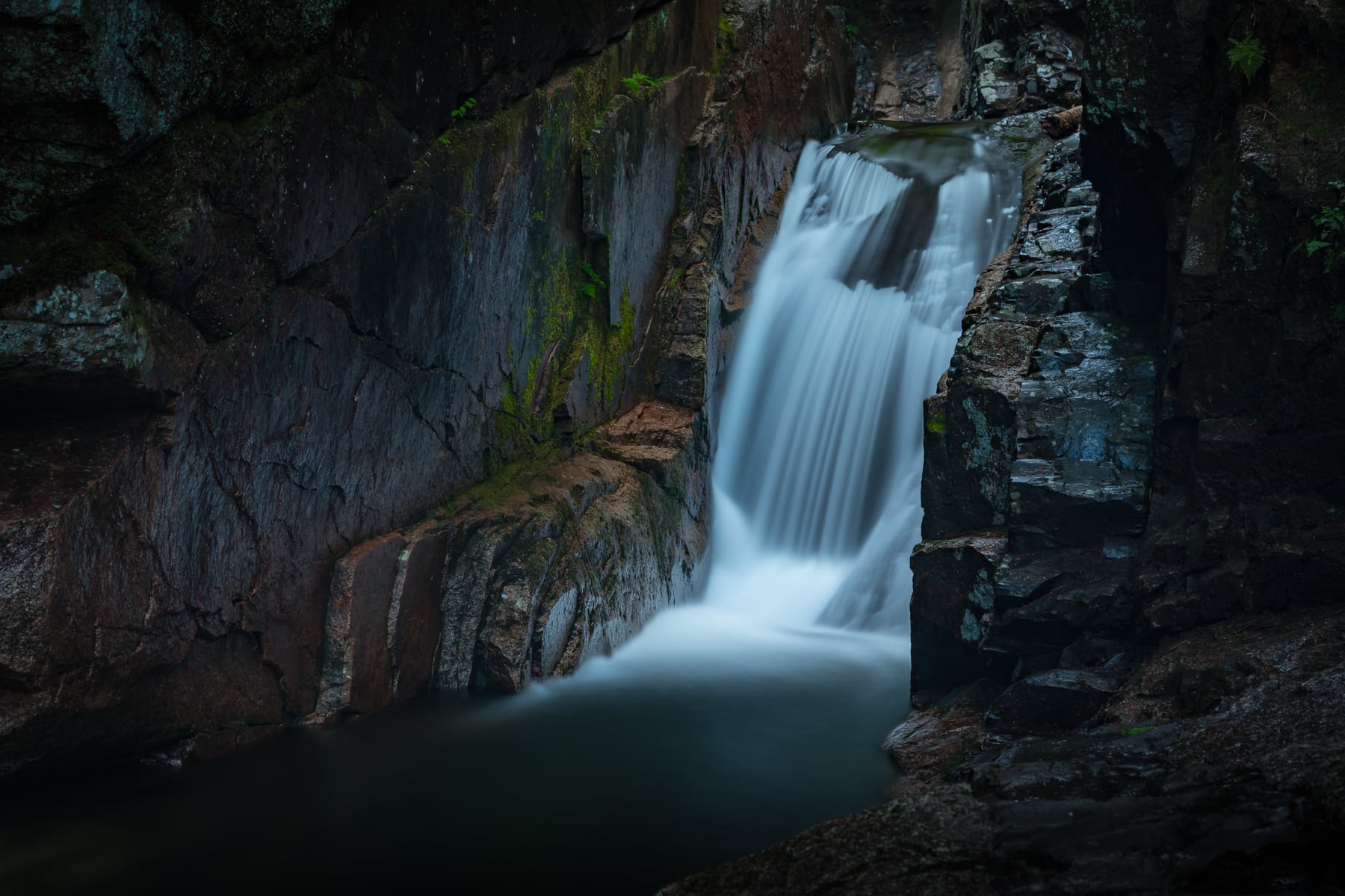 A White Mountain National Forest sign shares how Sabbaday Falls got its name.