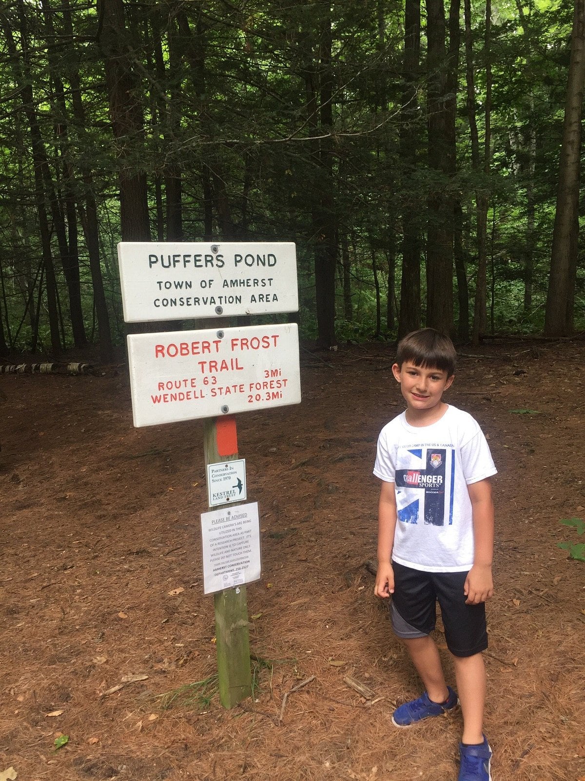 Puffer's Pond conservation area sign by the Robert Frost Trail in Amherst, Massachusetts.