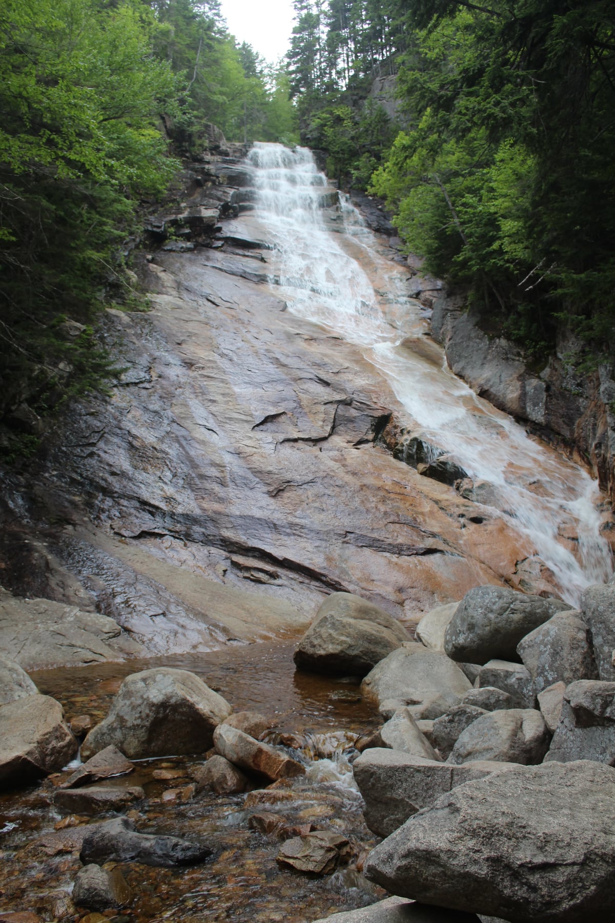 Ripley Falls sliding down a long granite slab into boulders in New Hampshire.